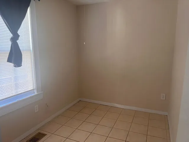 a view of an empty room and window