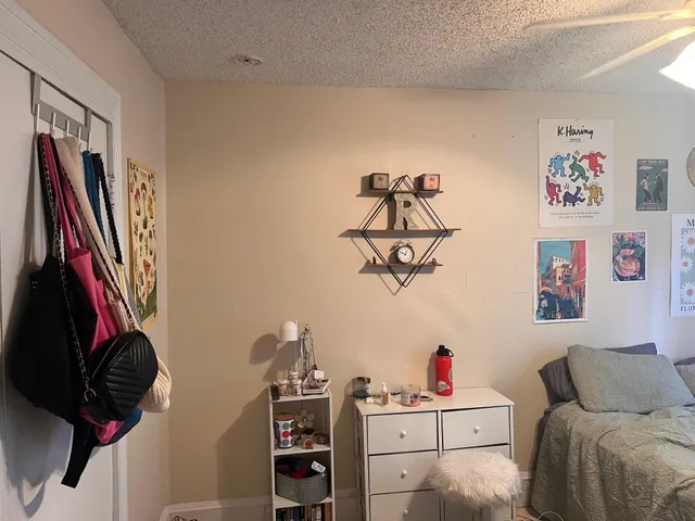 a bedroom with a bed and cabinets