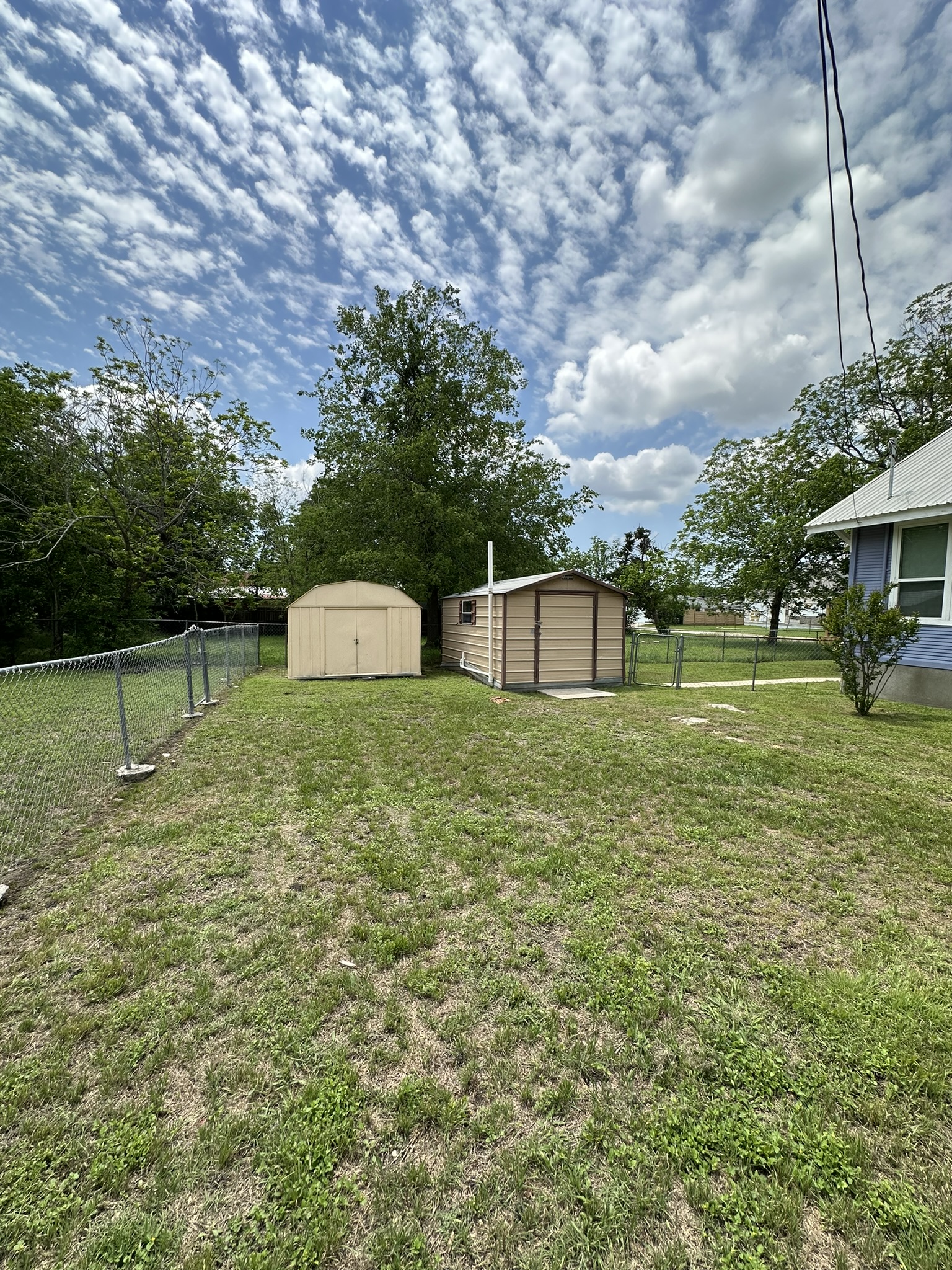 719 West 3rd Street Taylor, TX 76574 - Photo 26 of 31 View of yard with a storage shed and workshop