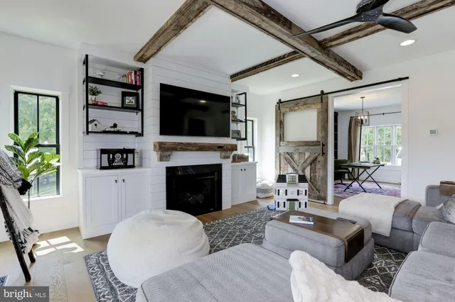 a spacious bathroom with a double vanity sink a mirror a bathtub and shower