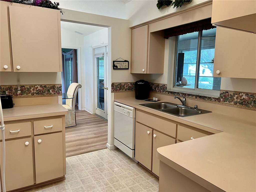 5333 Northwest 25th Loop Ocala, FL 34482 - Photo 15 of 20 a kitchen with a sink cabinets and window