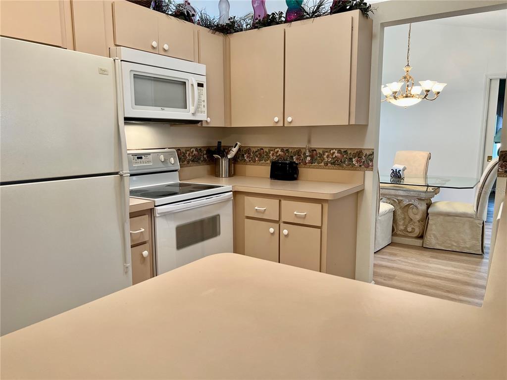 5333 Northwest 25th Loop Ocala, FL 34482 - Photo 17 of 20 a kitchen with stainless steel appliances a stove microwave and sink