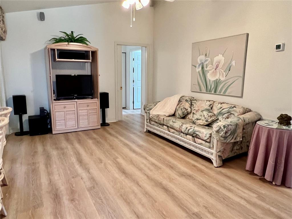 5333 Northwest 25th Loop Ocala, FL 34482 - Photo 18 of 20 a living room with furniture and a flat screen tv