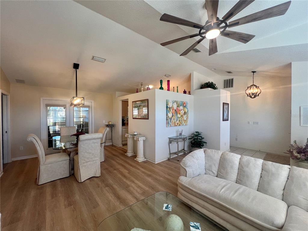 5333 Northwest 25th Loop Ocala, FL 34482 - Photo 2 of 20 a living room with furniture and a chandelier