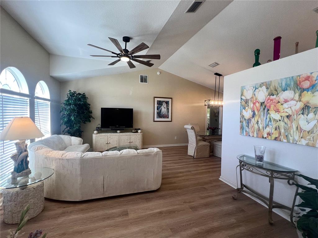 5333 Northwest 25th Loop Ocala, FL 34482 - Photo 3 of 20 a living room with furniture and a flat screen tv