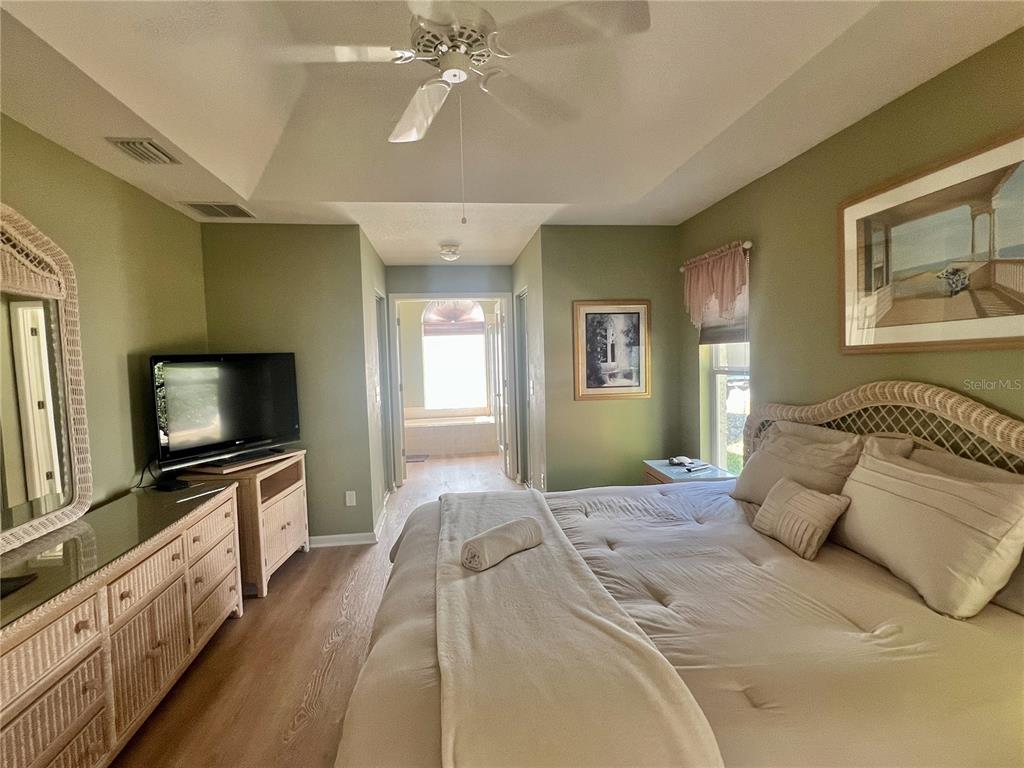 5333 Northwest 25th Loop Ocala, FL 34482 - Photo 5 of 20 a bedroom with a large bed and a flat screen tv