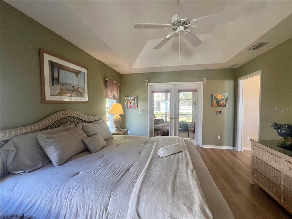 5333 Northwest 25th Loop Ocala, FL 34482 - Photo 7 of 20 a spacious bedroom with a bed and ceiling fan