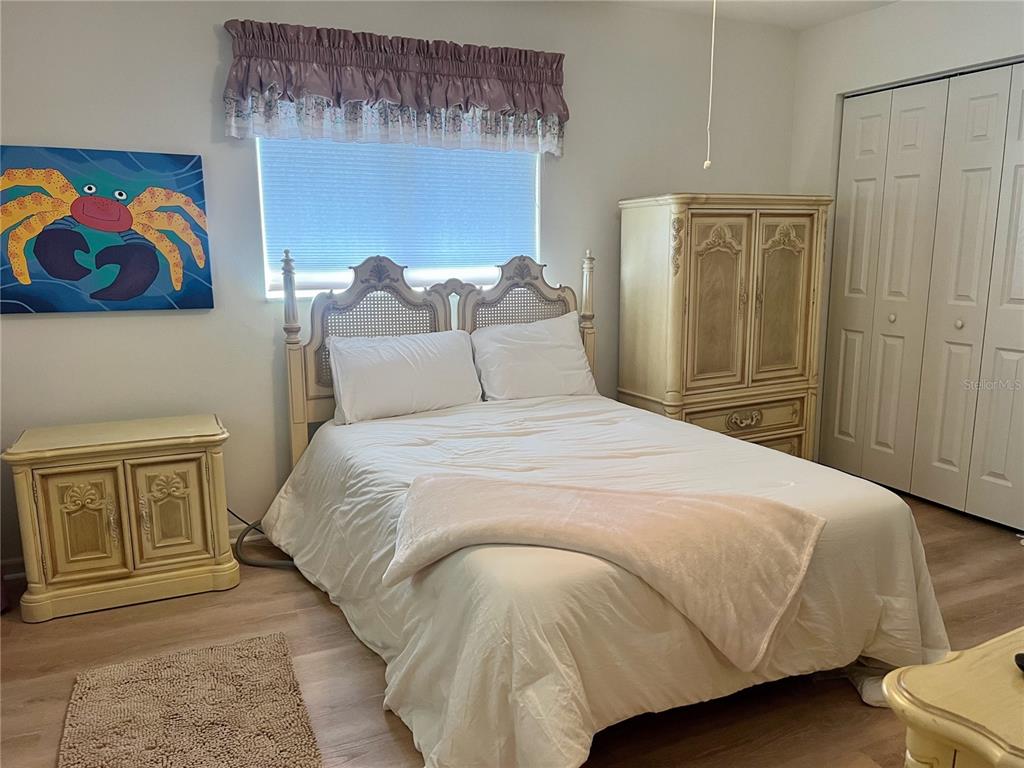 5333 Northwest 25th Loop Ocala, FL 34482 - Photo 9 of 20 a bedroom with a bed and a painting on the wall