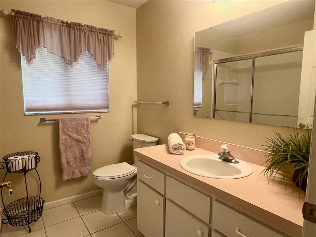 5333 Northwest 25th Loop Ocala, FL 34482 - Photo 10 of 20 a bathroom with a sink toilet and a mirror