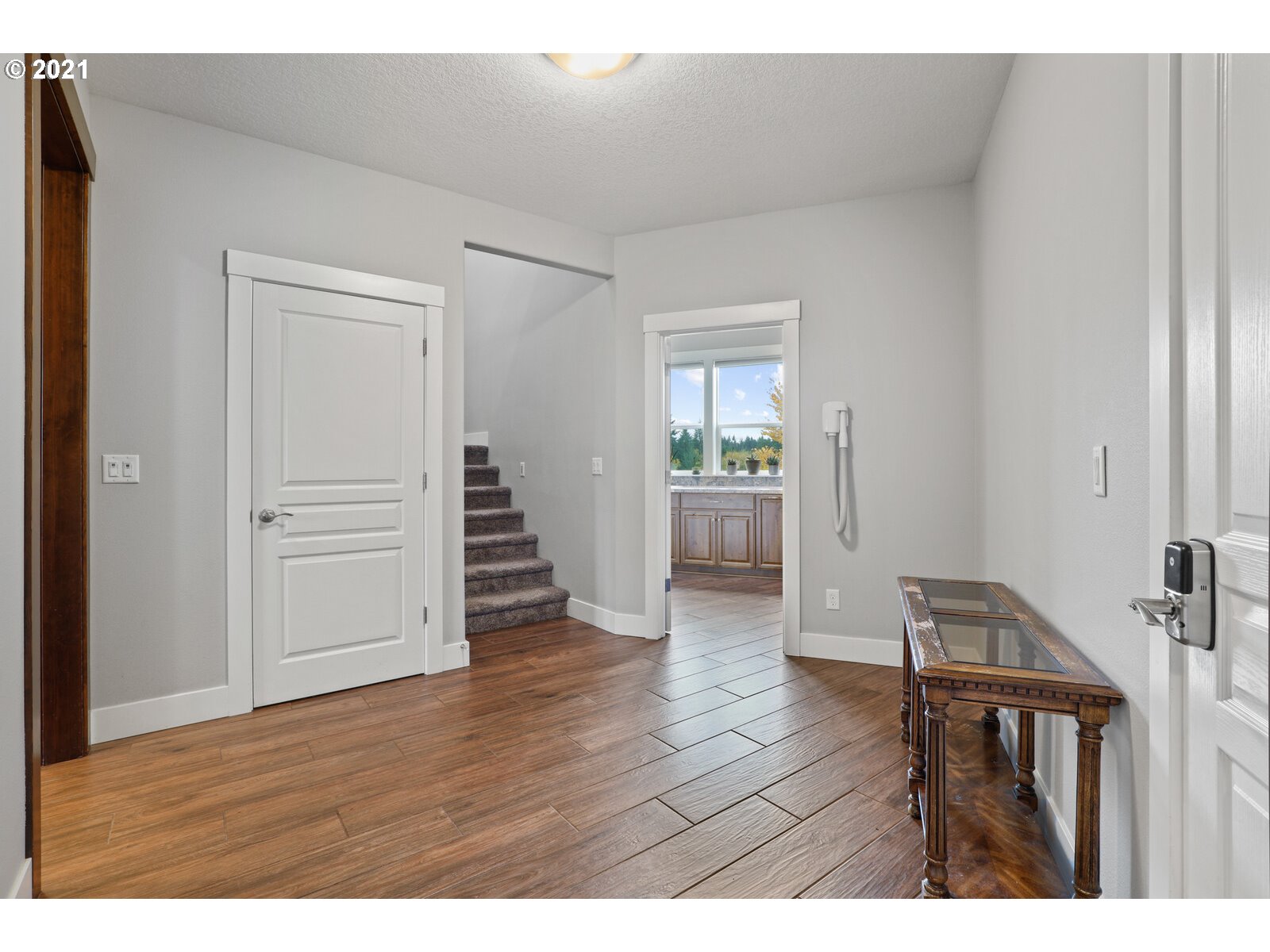 32822 Northwest Pekin Ferry Road Ridgefield, WA 98642 - Photo 22 of 32 a view of an empty room with wooden floor and closet