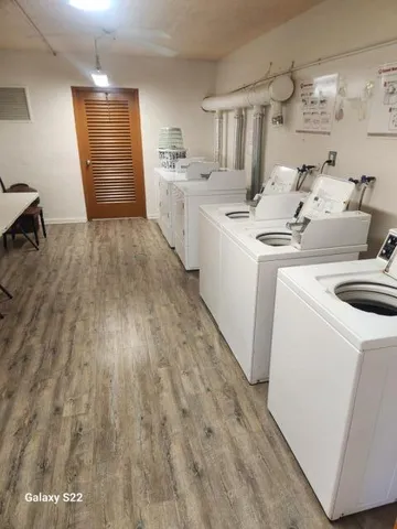 a view of swimming pool with a yard and plants