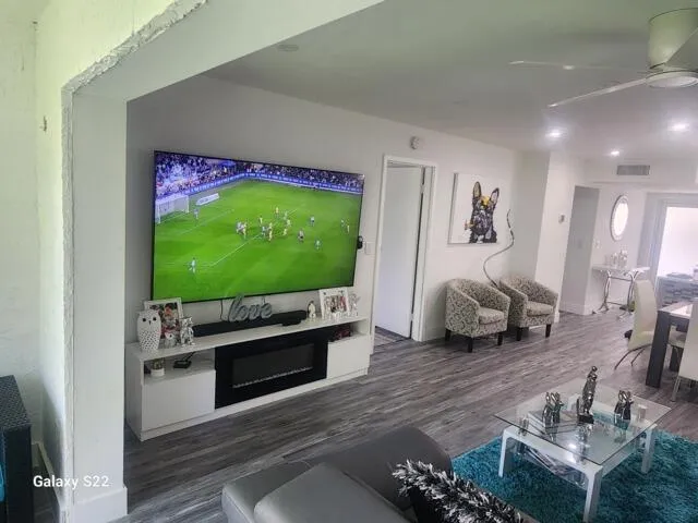 a living room with furniture and a flat screen tv