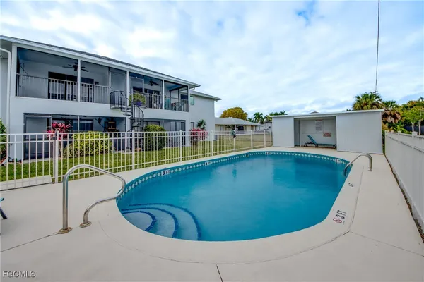 a view of a swimming pool with a lounge chairs