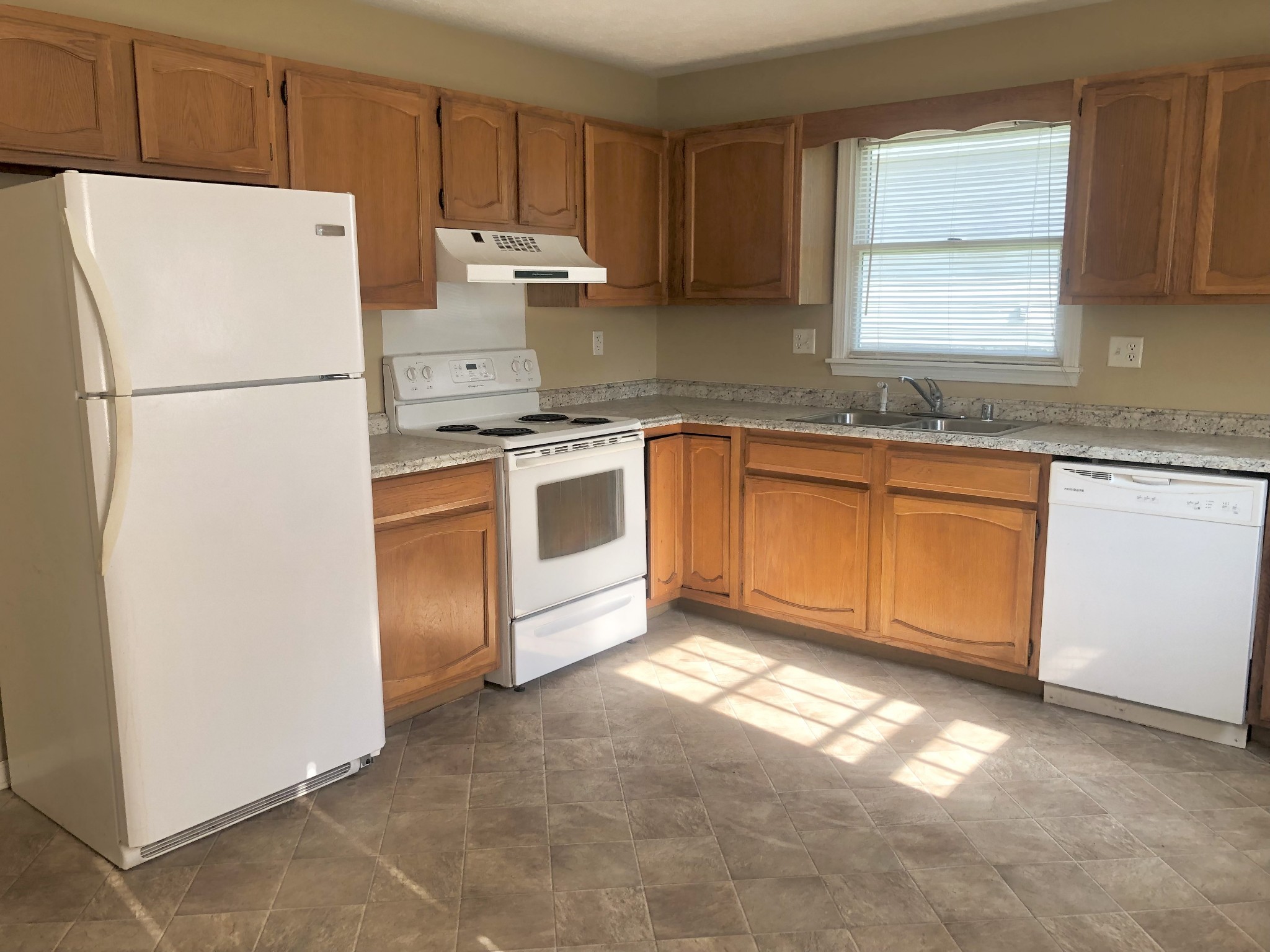 1230 Pyle Lane Hopkinsville, KY 42240 - Photo 8 of 10 a kitchen with granite countertop cabinets stainless steel appliances a sink and a window