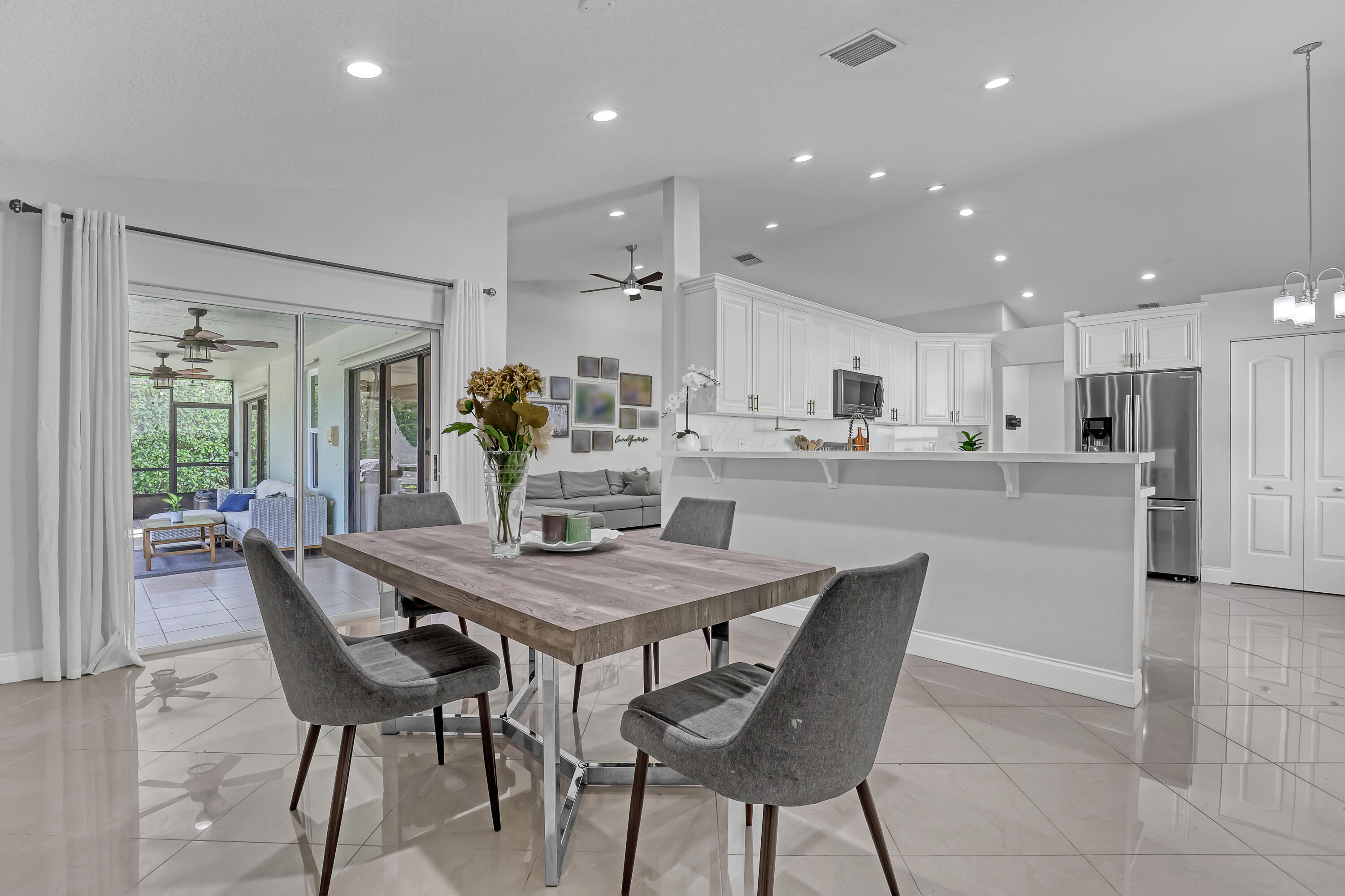 5770 Aspen Ridge Circle Delray Beach, FL 33484 - Photo 17 of 60 Dining area and kitchen