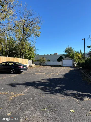a view of street with parked cars