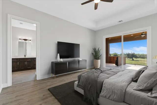 a bedroom with a bed and a television