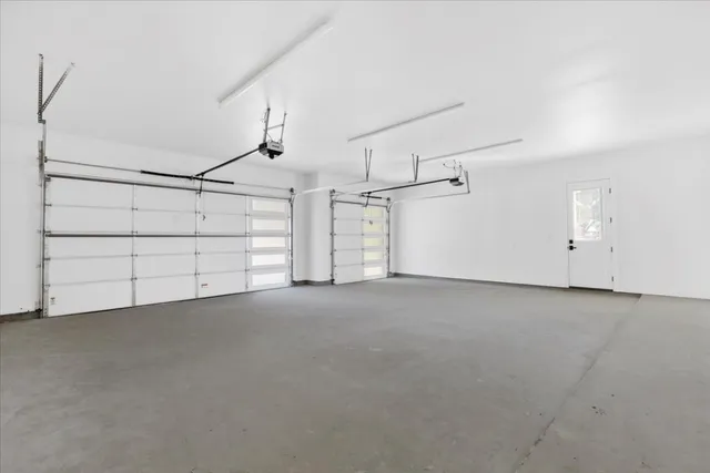 a view of a patio with couches potted plants and pool