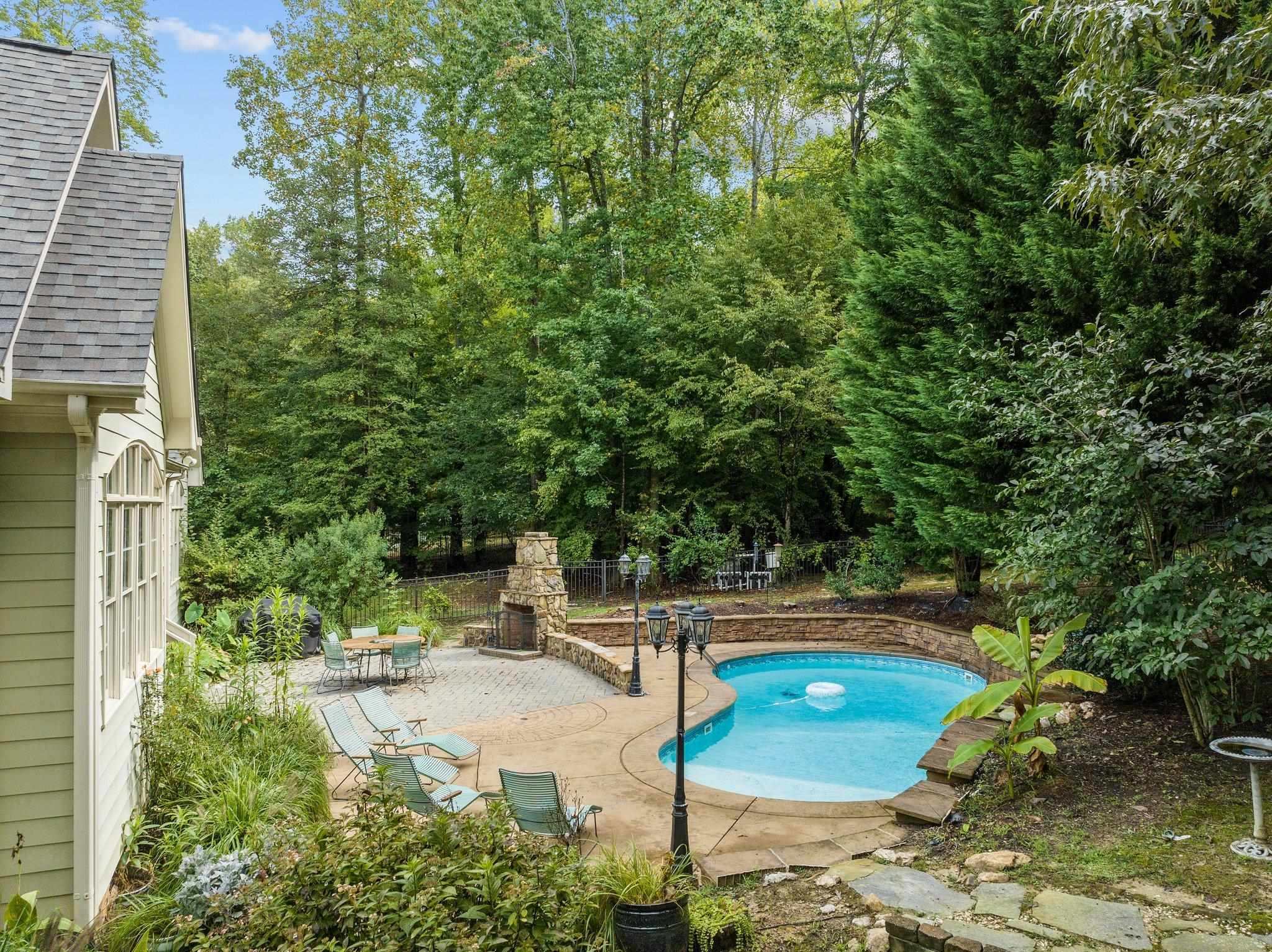 12804 River Dance Drive Raleigh, NC 27613 - Photo 54 of 59 a view of a swimming pool with a yard