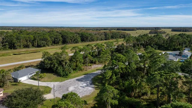 a view of a field with an ocean