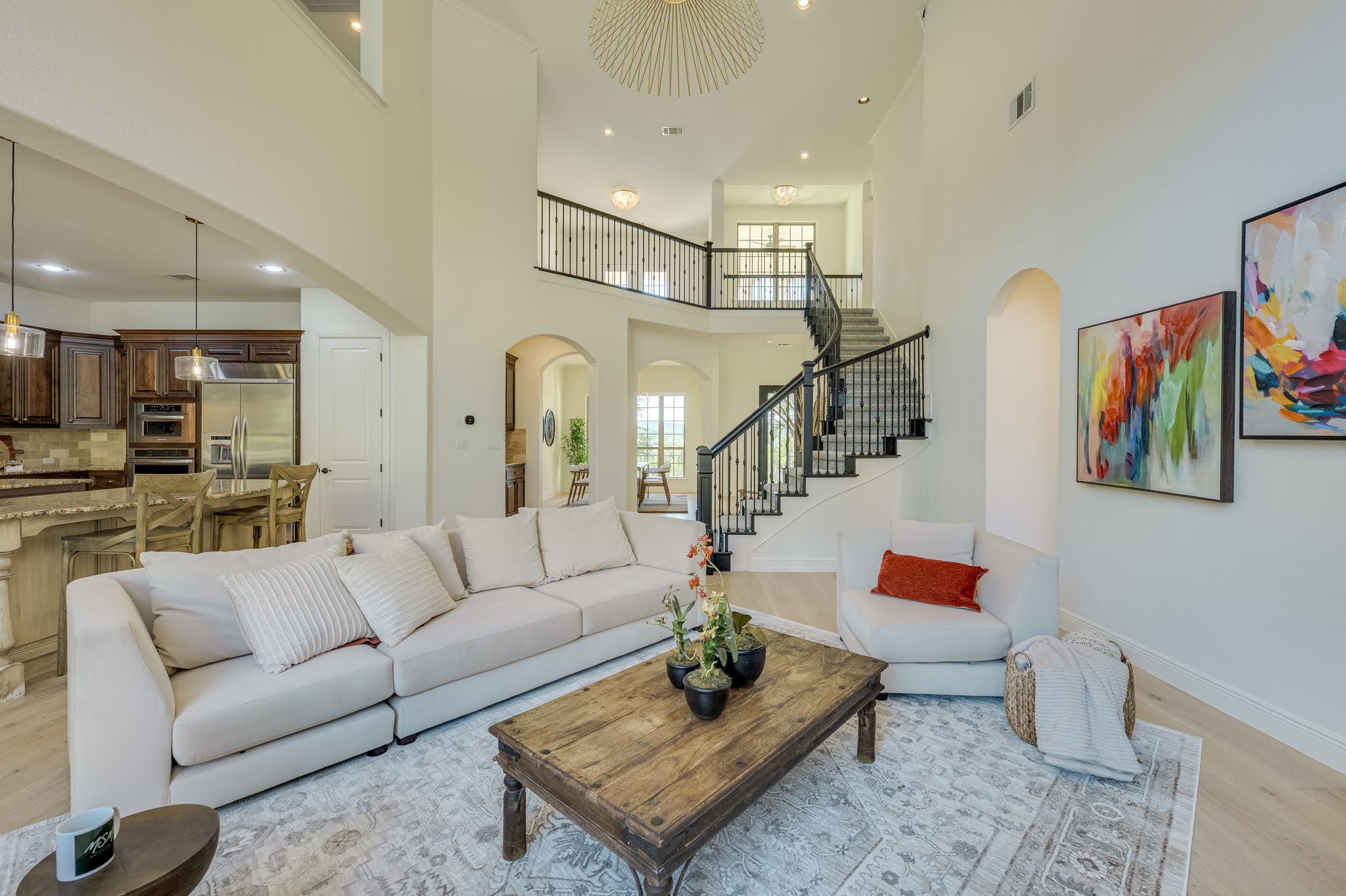 11612 Shoreview Overlook Austin, TX 78732 - Photo 40 of 40 An open floorplan centers around soaring ceilings, light wood floors, and a curved staircase.