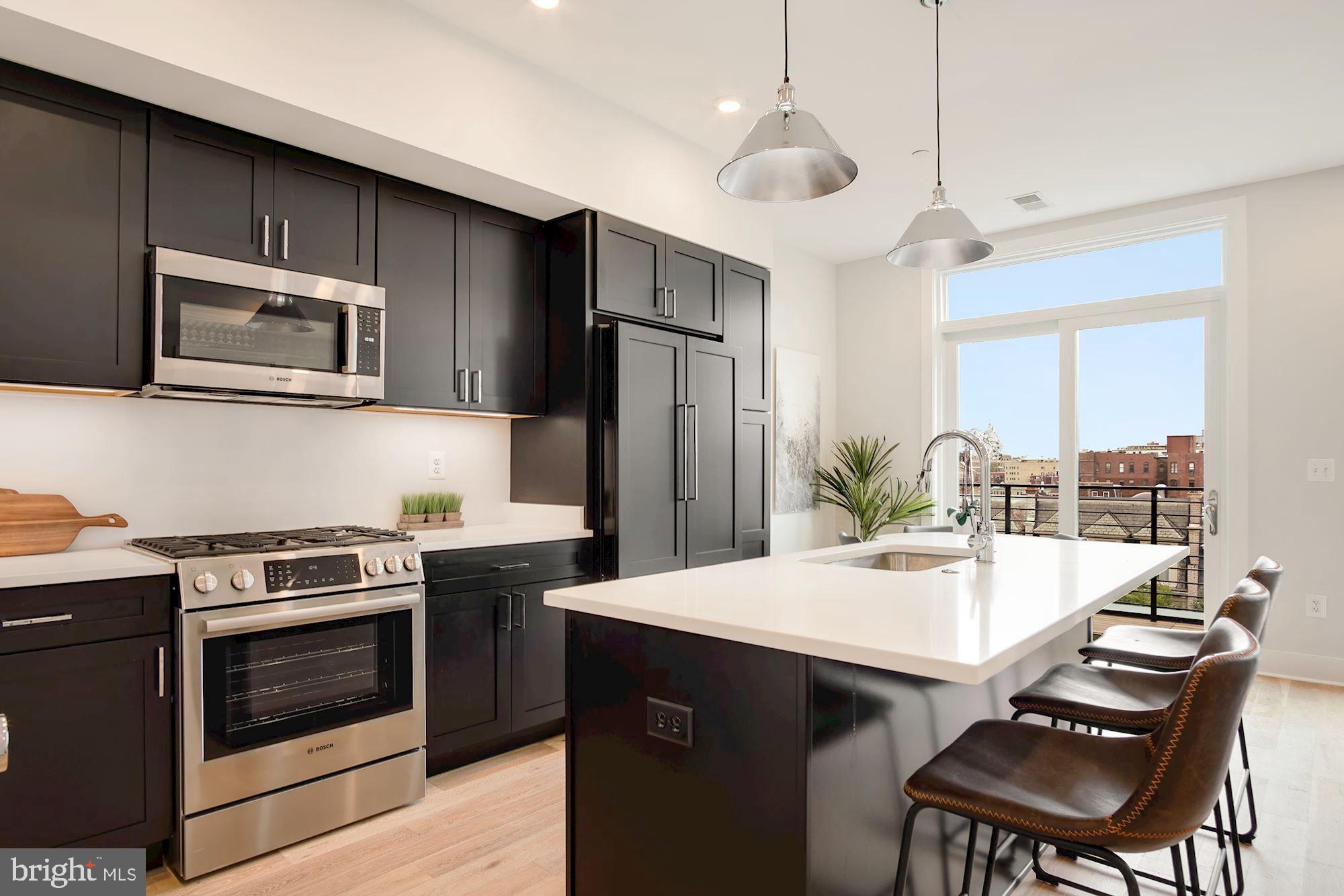 2717 Ontario Road Northwest, Unit 401 Washington, DC 20009 - Photo 5 of 19 Kitchen Island