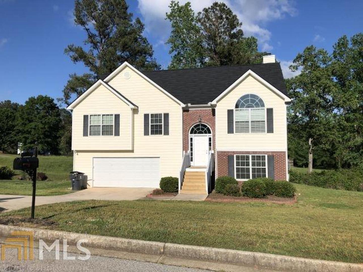 3445 Cascade Trail Villa Rica, GA 30180 - Photo 1 of 1 a front view of a house with a yard