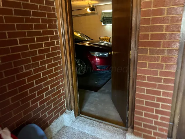 a view of a room with gym equipment and a large window