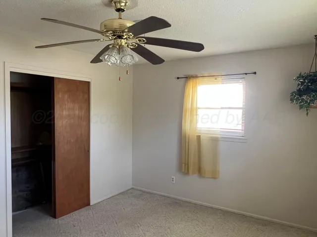 a view of a house with a flower garden