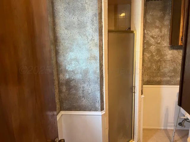 swimming pool view with a seating space