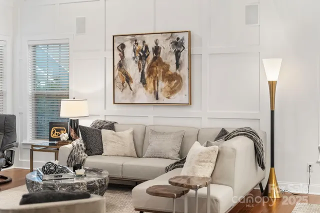 a living room with furniture and a bathtub