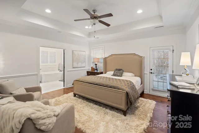 a bed room with a bed and a chandelier