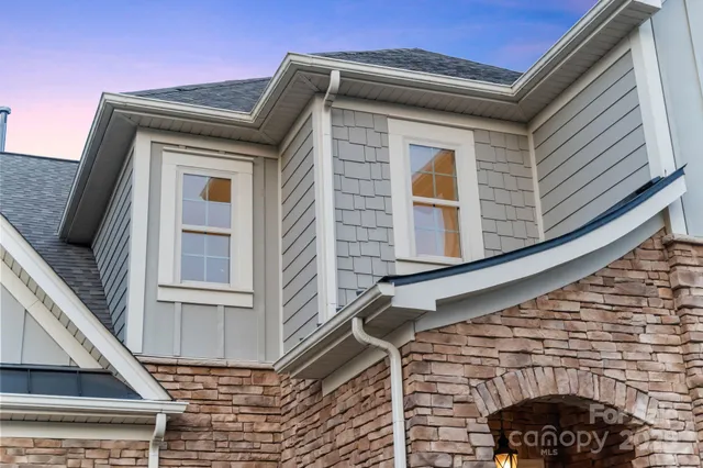 a front view of a house with glass windows