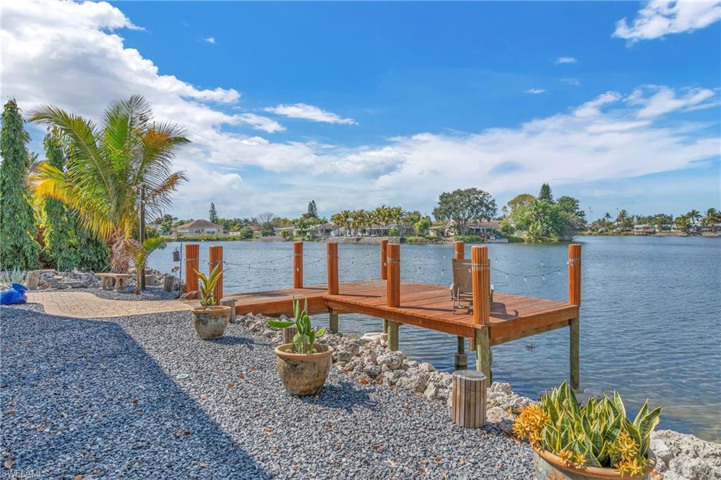 3001 50th Street Southwest Naples, FL 34116 - Photo 2 of 46 a view of a lake with a terrace
