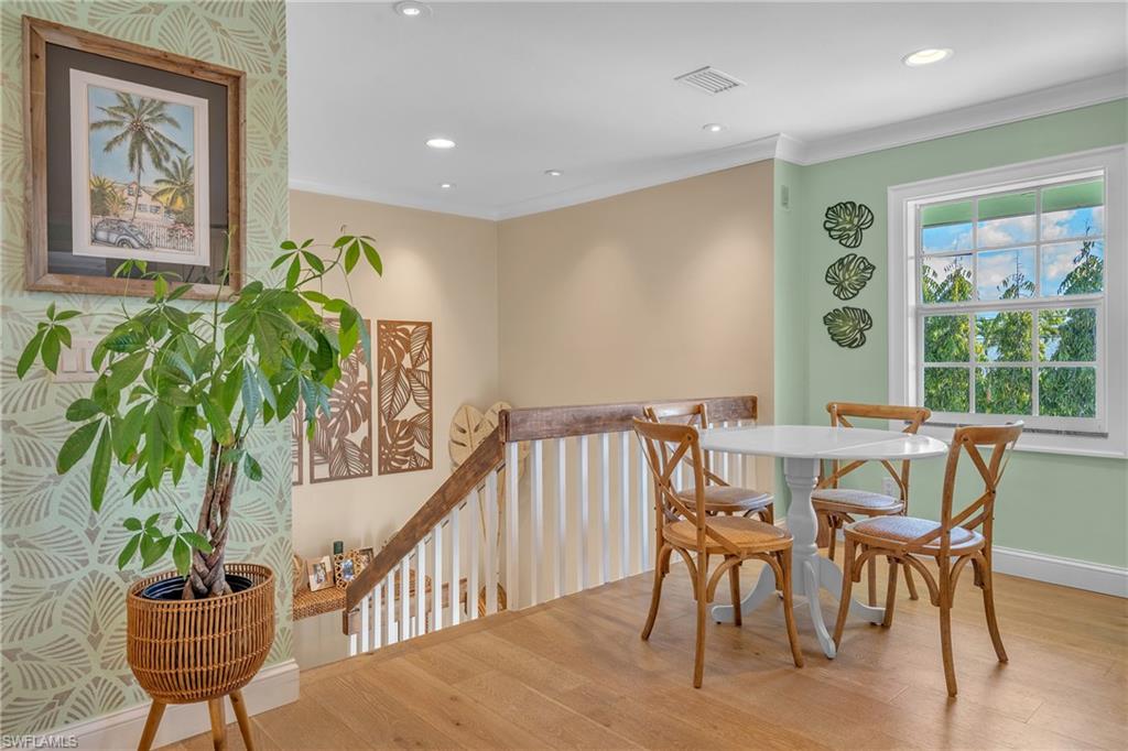 3001 50th Street Southwest Naples, FL 34116 - Photo 27 of 46 a view of a dining room with furniture window and wooden floor