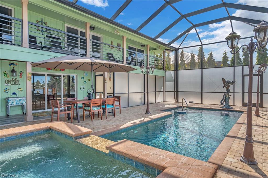 3001 50th Street Southwest Naples, FL 34116 - Photo 30 of 46 a view of a swimming pool with a patio