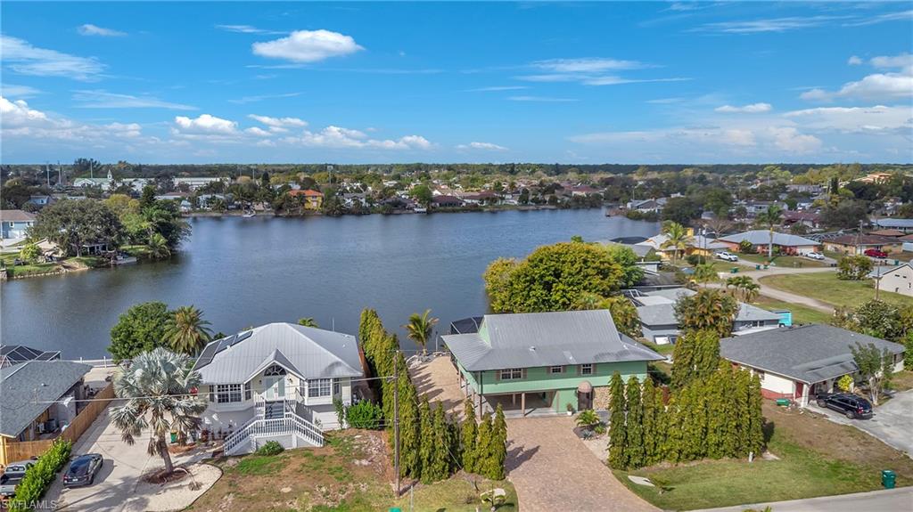 3001 50th Street Southwest Naples, FL 34116 - Photo 36 of 46 an aerial view of a house with a lake view
