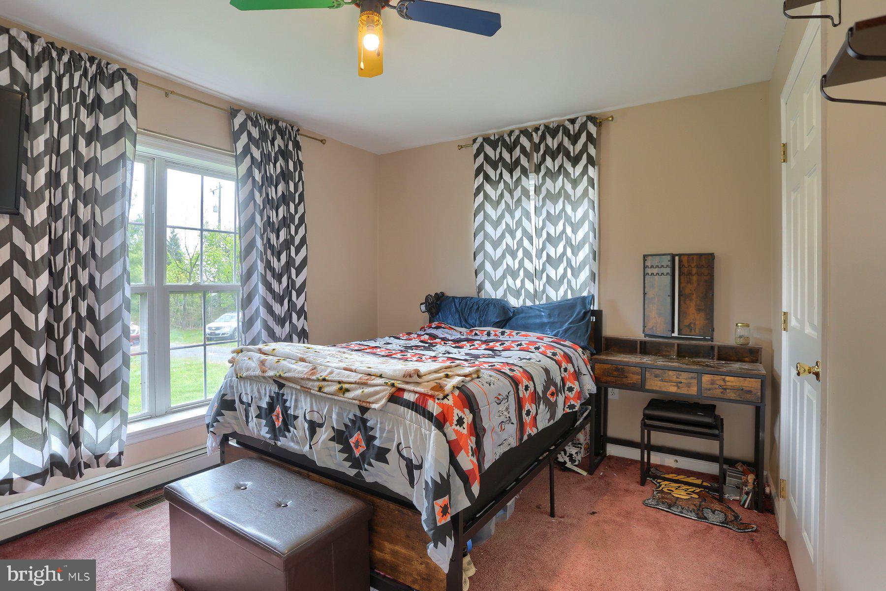5402 Durham Road Pipersville, PA 18947 - Photo 12 of 17 Cozy bedroom with vibrant decor.