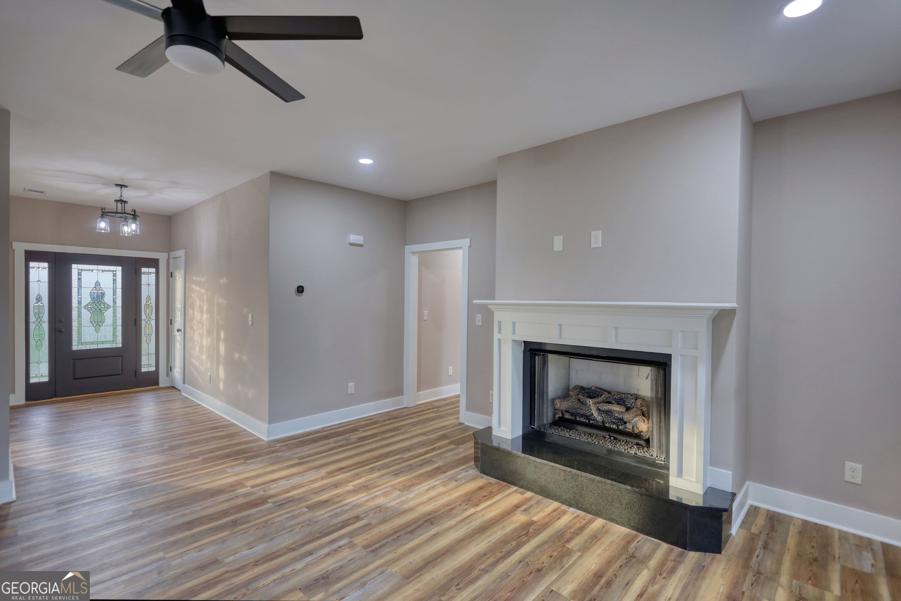 2941 Old Buckhead Road Madison, GA 30650 - Photo 11 of 58 a view of a livingroom with a fireplace and window