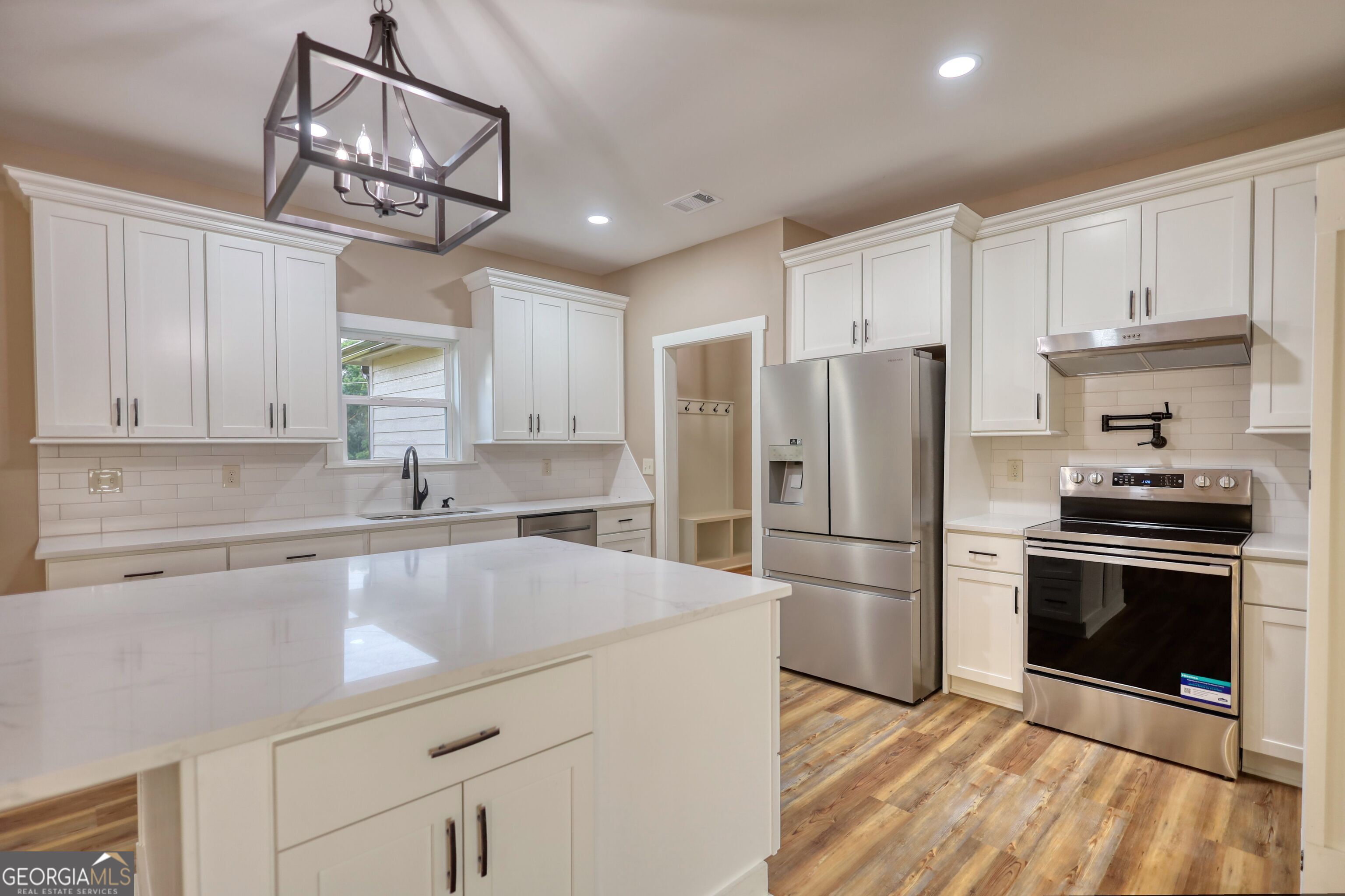 2941 Old Buckhead Road Madison, GA 30650 - Photo 14 of 58 a kitchen with stainless steel appliances a refrigerator sink and cabinets