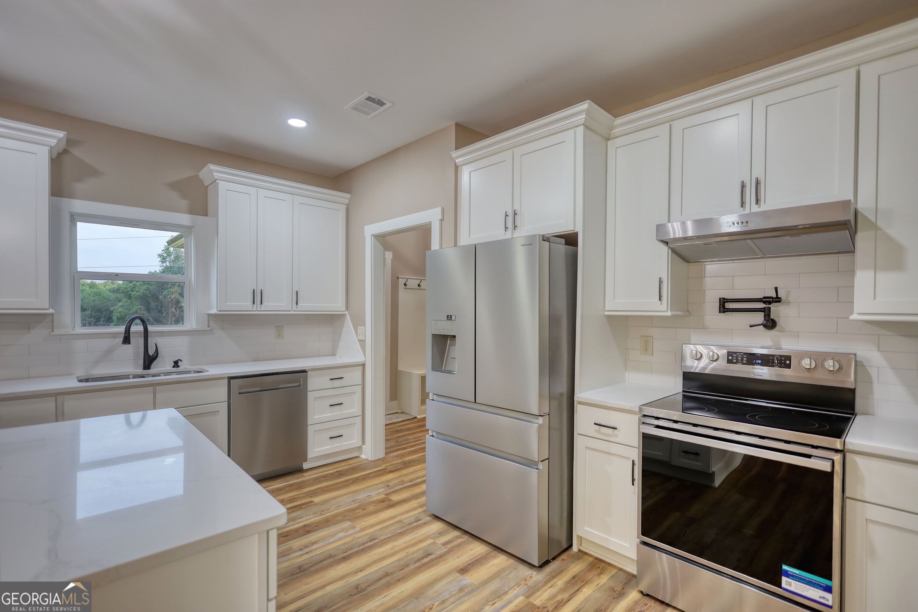 2941 Old Buckhead Road Madison, GA 30650 - Photo 15 of 58 a kitchen with cabinets stainless steel appliances and a sink