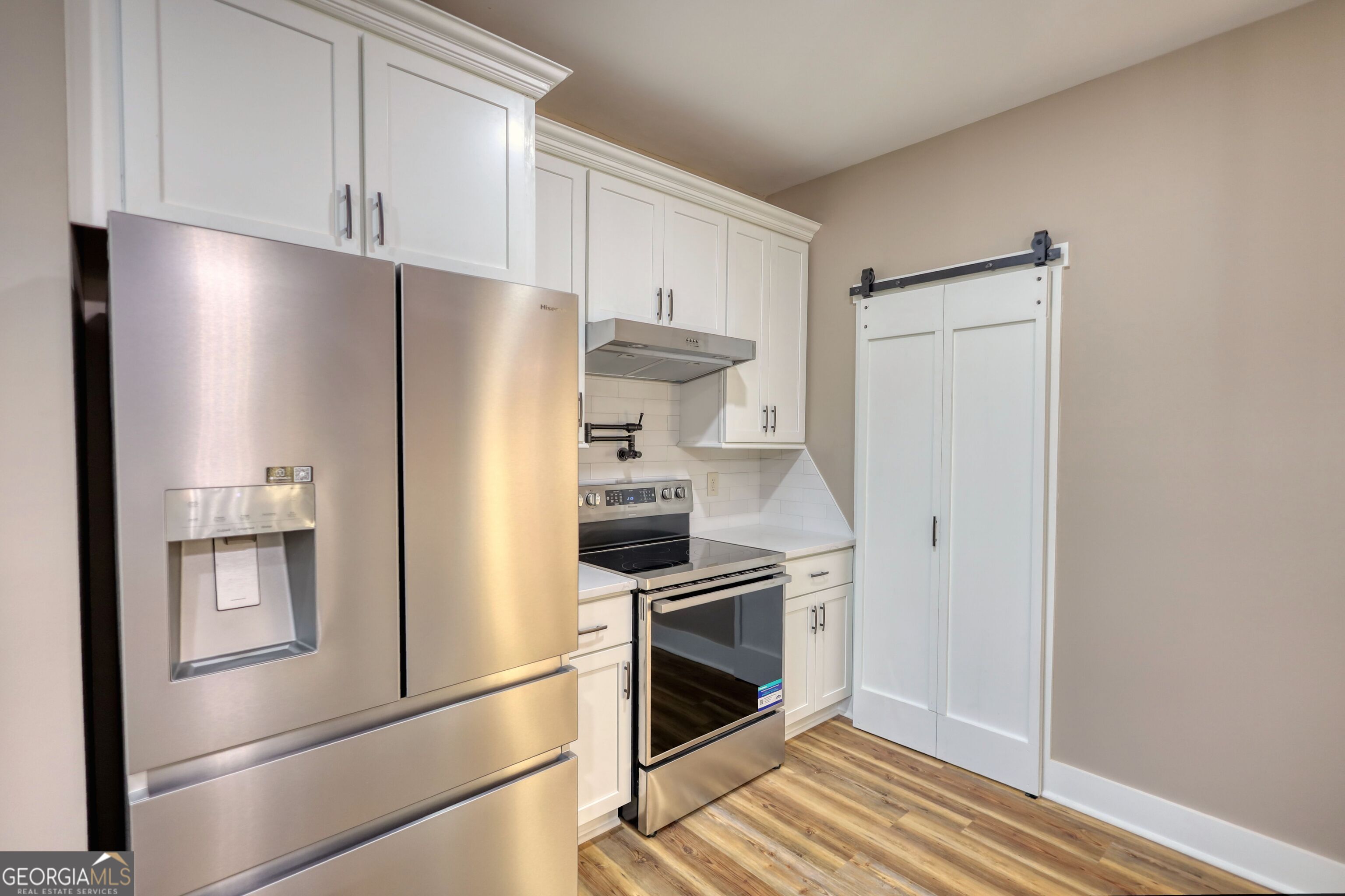 2941 Old Buckhead Road Madison, GA 30650 - Photo 16 of 58 a kitchen with stainless steel appliances a refrigerator and a stove