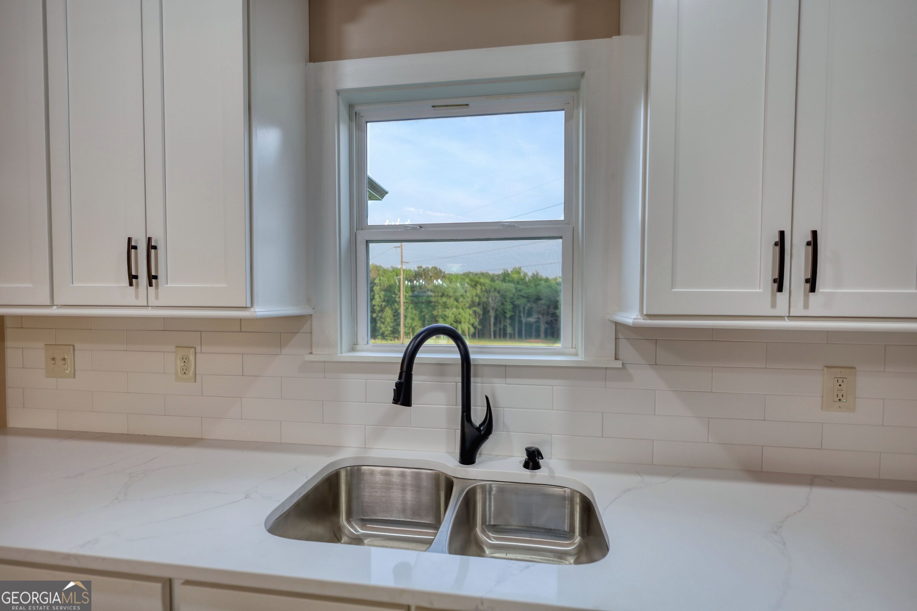2941 Old Buckhead Road Madison, GA 30650 - Photo 17 of 58 a kitchen with a sink and a window