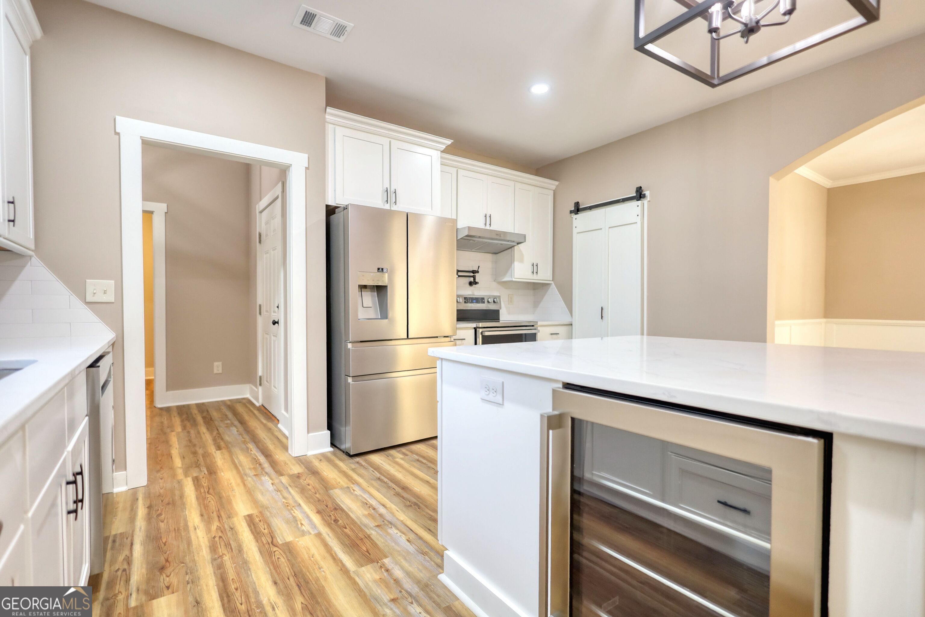 2941 Old Buckhead Road Madison, GA 30650 - Photo 18 of 58 a kitchen with a refrigerator a sink and cabinets