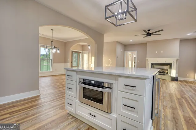 a kitchen with stainless steel appliances a refrigerator sink and cabinets