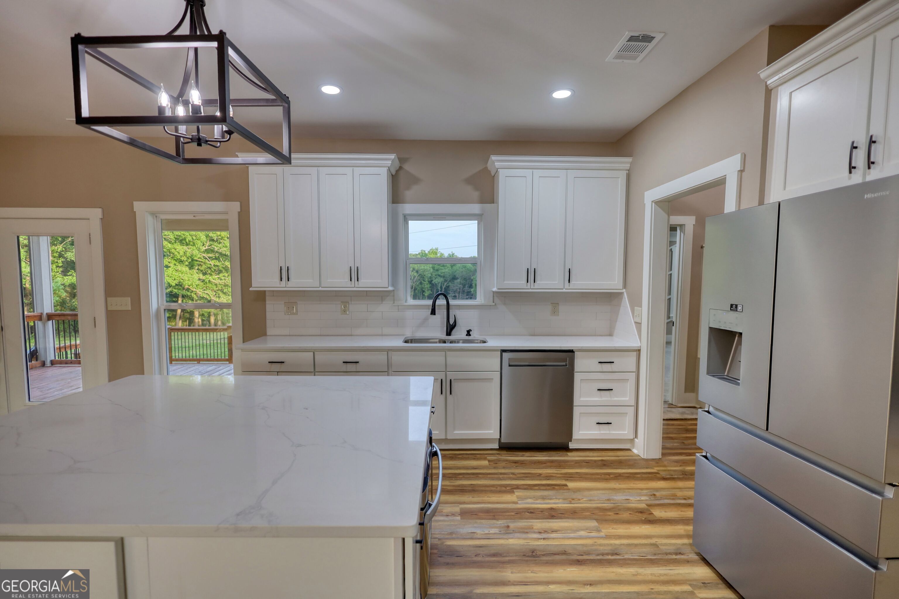 2941 Old Buckhead Road Madison, GA 30650 - Photo 20 of 58 a kitchen with stainless steel appliances a refrigerator sink and cabinets