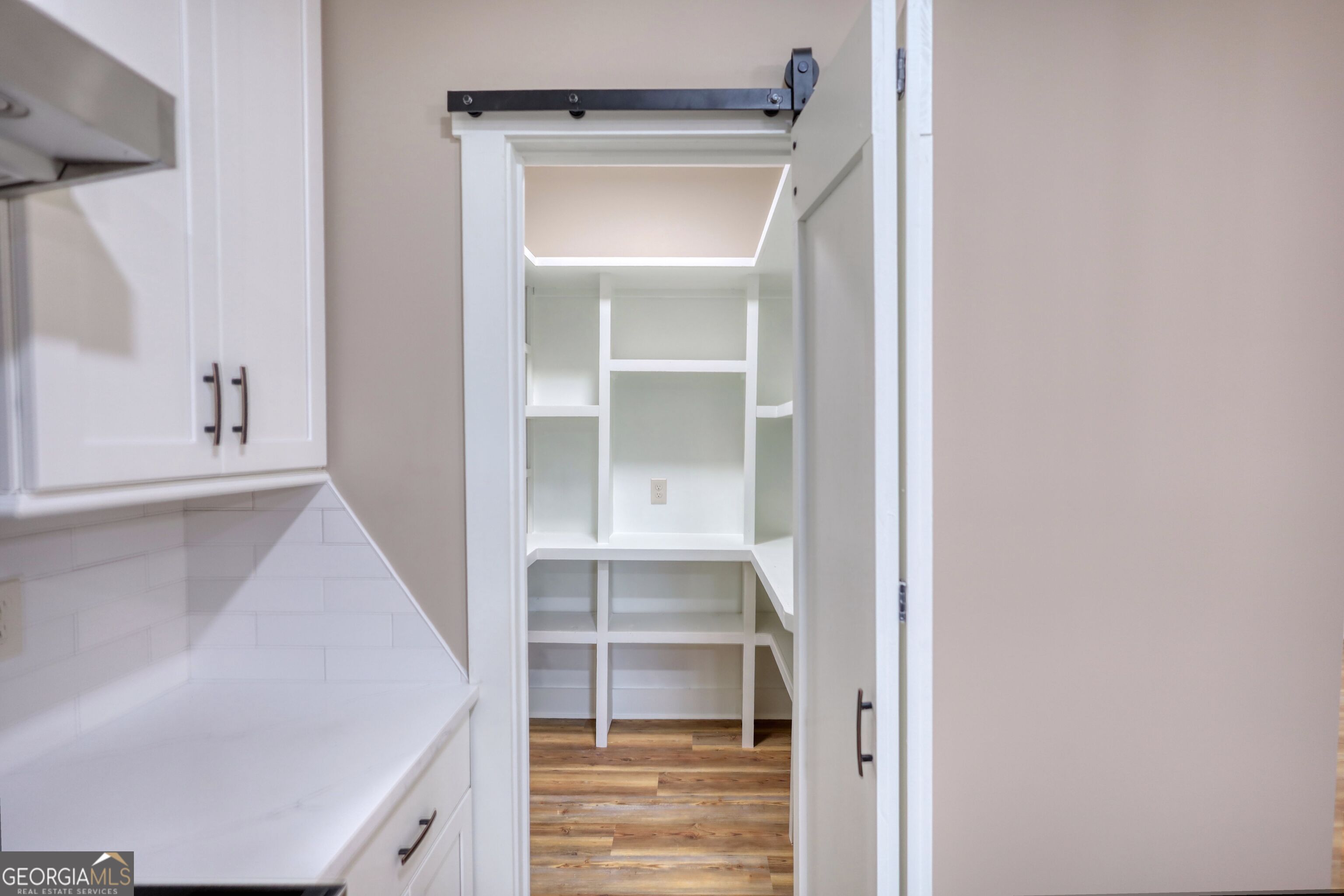 2941 Old Buckhead Road Madison, GA 30650 - Photo 22 of 58 a view of walk in closet with empty racks