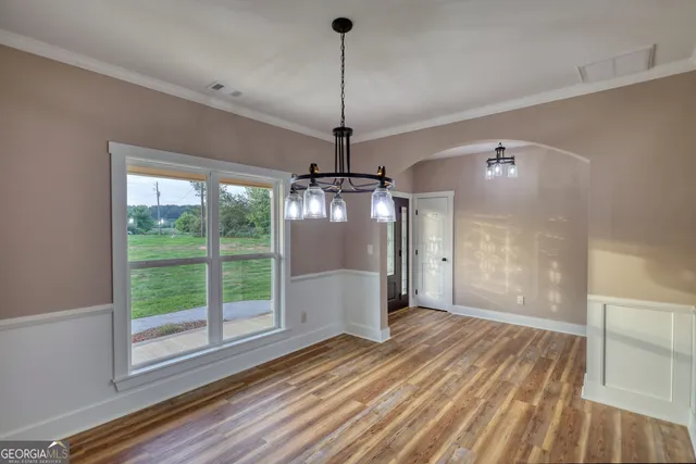 a view of a room with window wooden floor and outdoor space