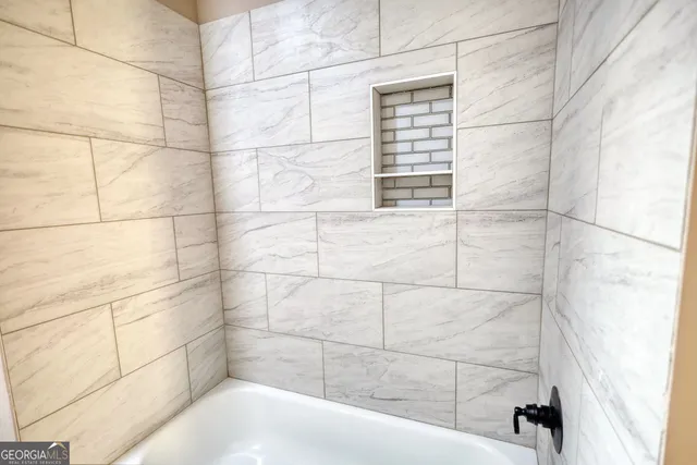 a aerial view of a house with a yard