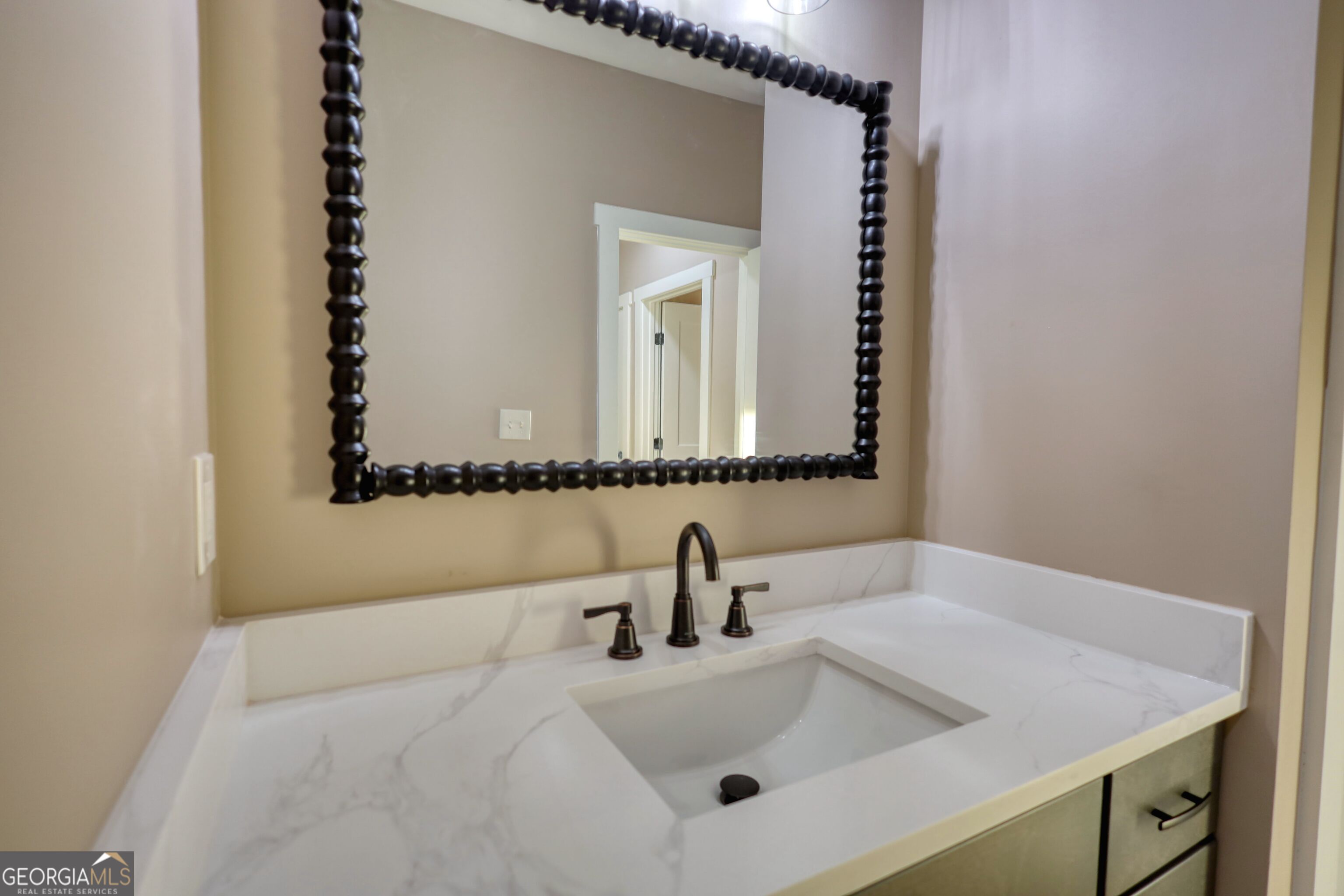 2941 Old Buckhead Road Madison, GA 30650 - Photo 48 of 58 a bathroom with a sink and a mirror